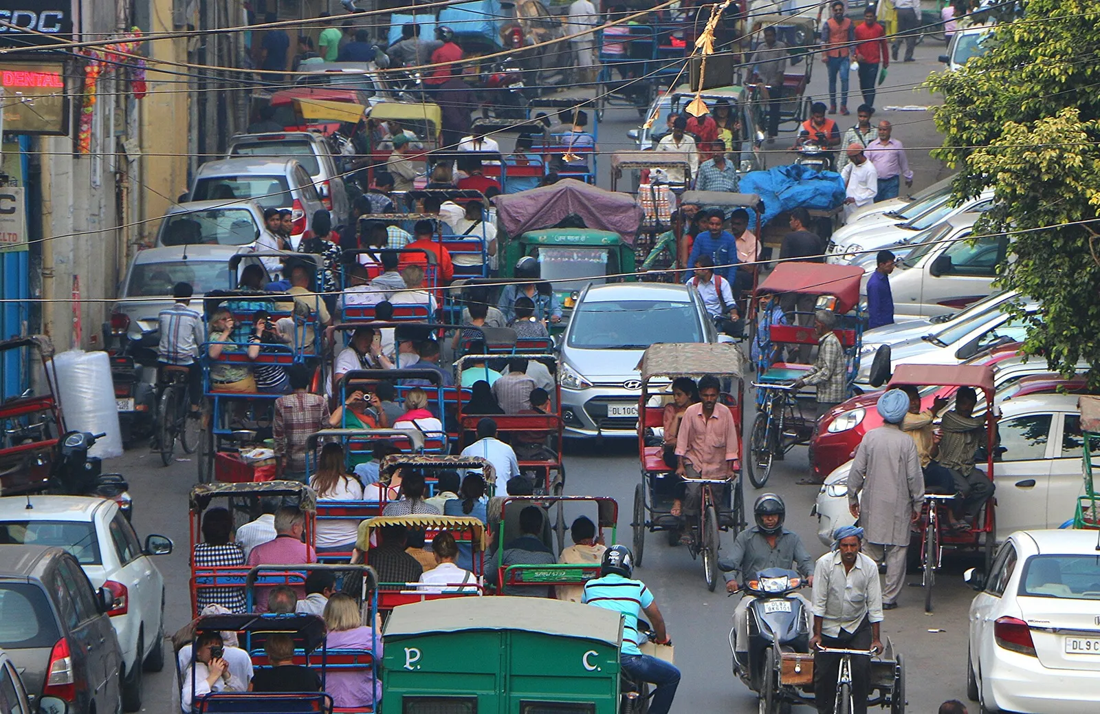 Busy Chandni Chowk street with cycle rickshaws in Delhi