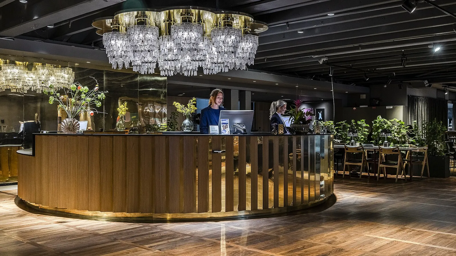 Hotel front desk under a crystal chandelier