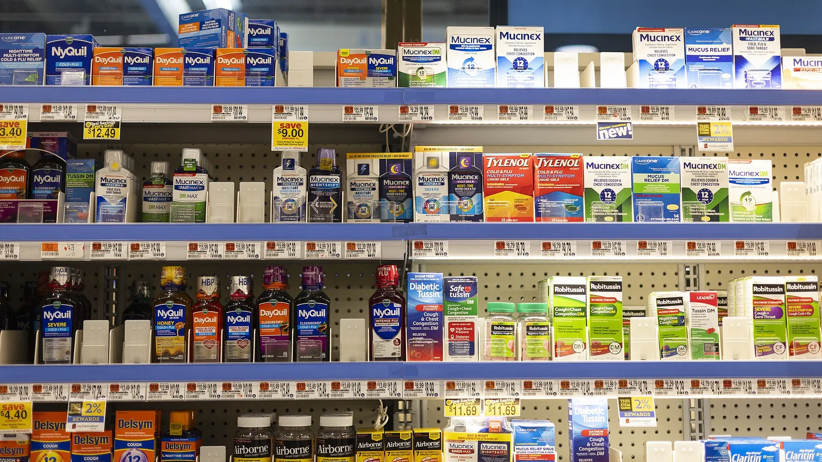 Shelves stocked with boxed over-the-counter medicines