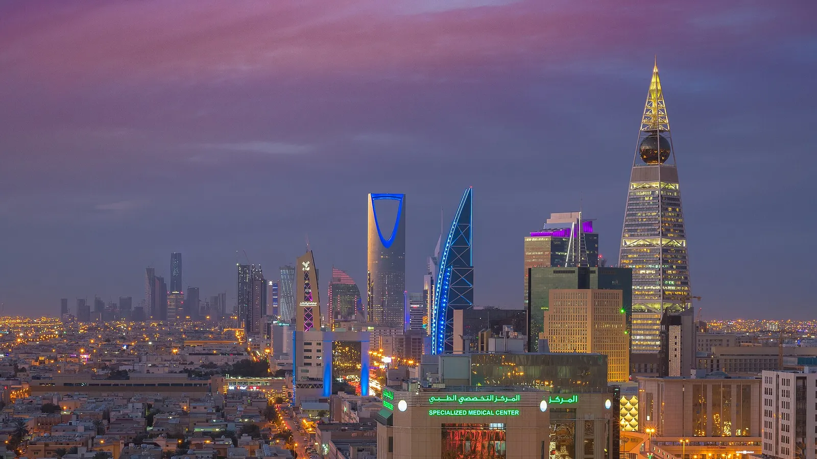 Riyadh skyline at dusk with the Kingdom Centre tower