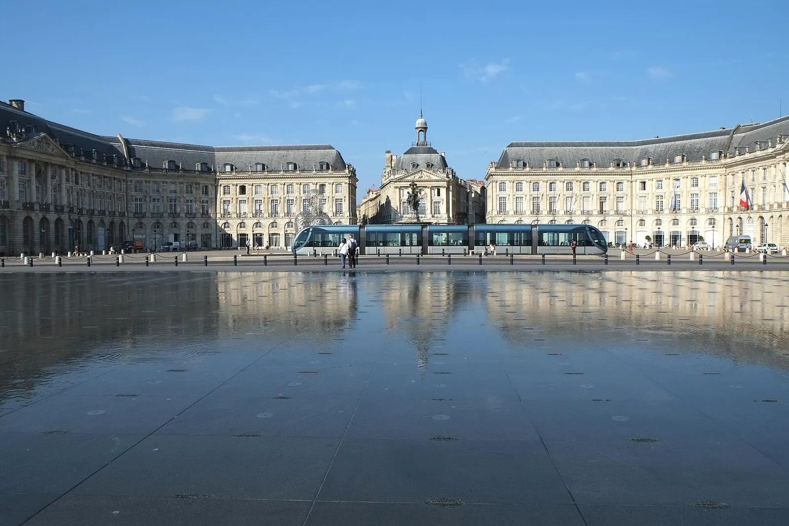 Place de la Bourse and the Miroir d'eau on the Bordeaux waterfront, with a tram passing