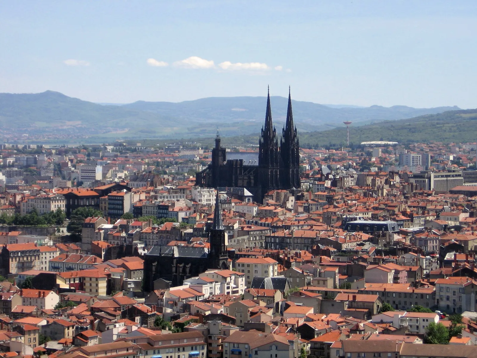 Clermont-Ferrand and its black-stone cathedral seen from Montjuzet Park, with volcanic hills behind
