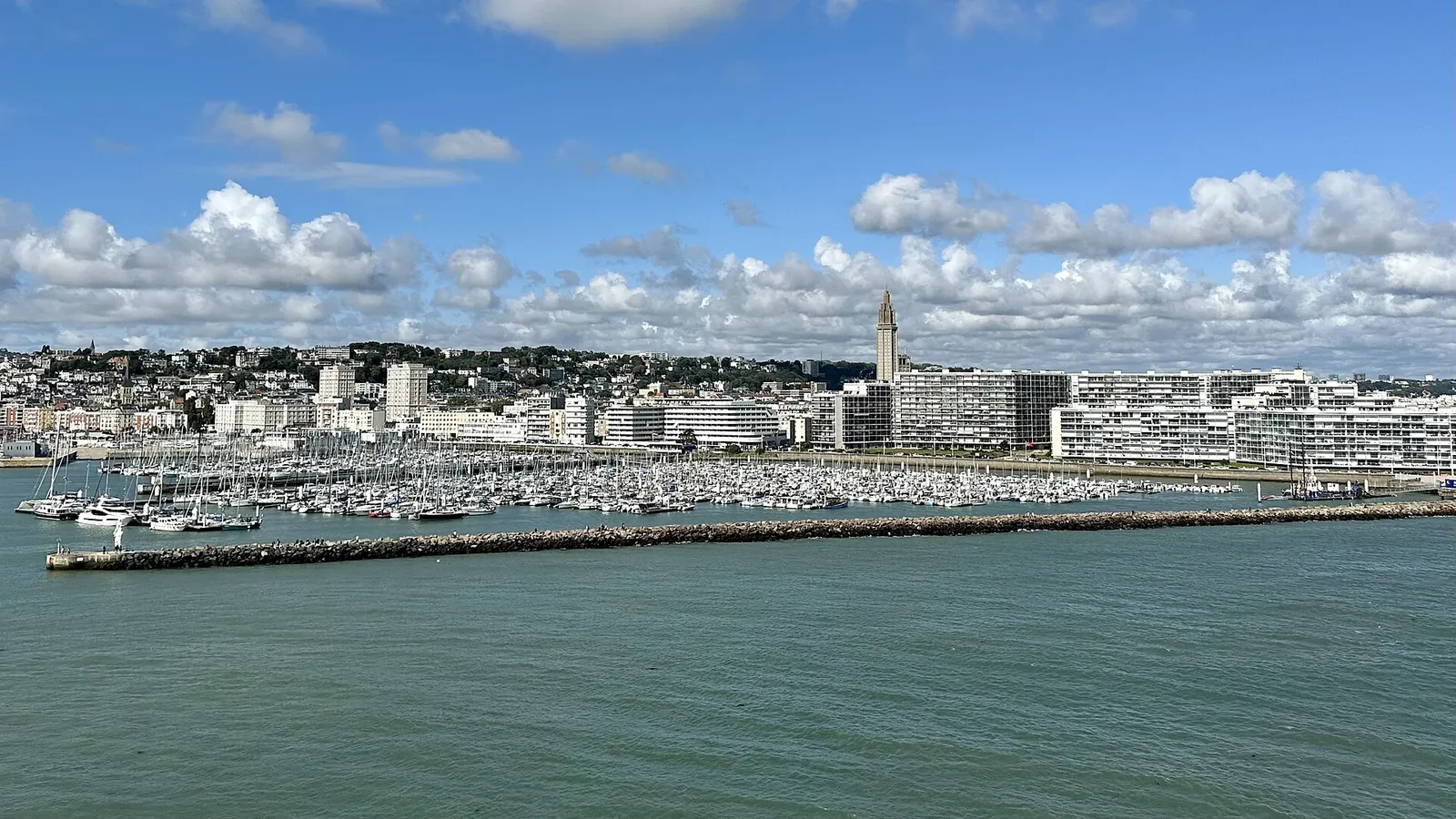 Le Havre's marina and seafront with the Saint-Joseph church tower, seen from the sea