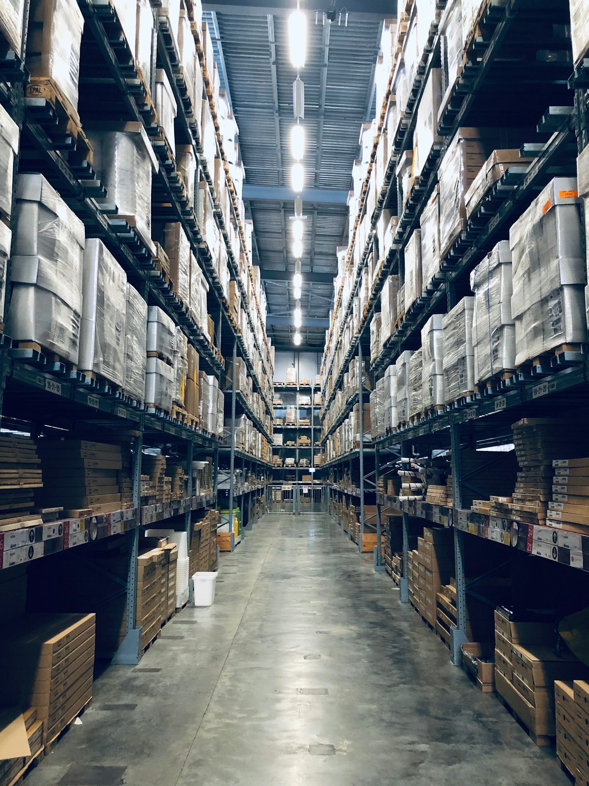 Warehouse racking with raw material and finished goods