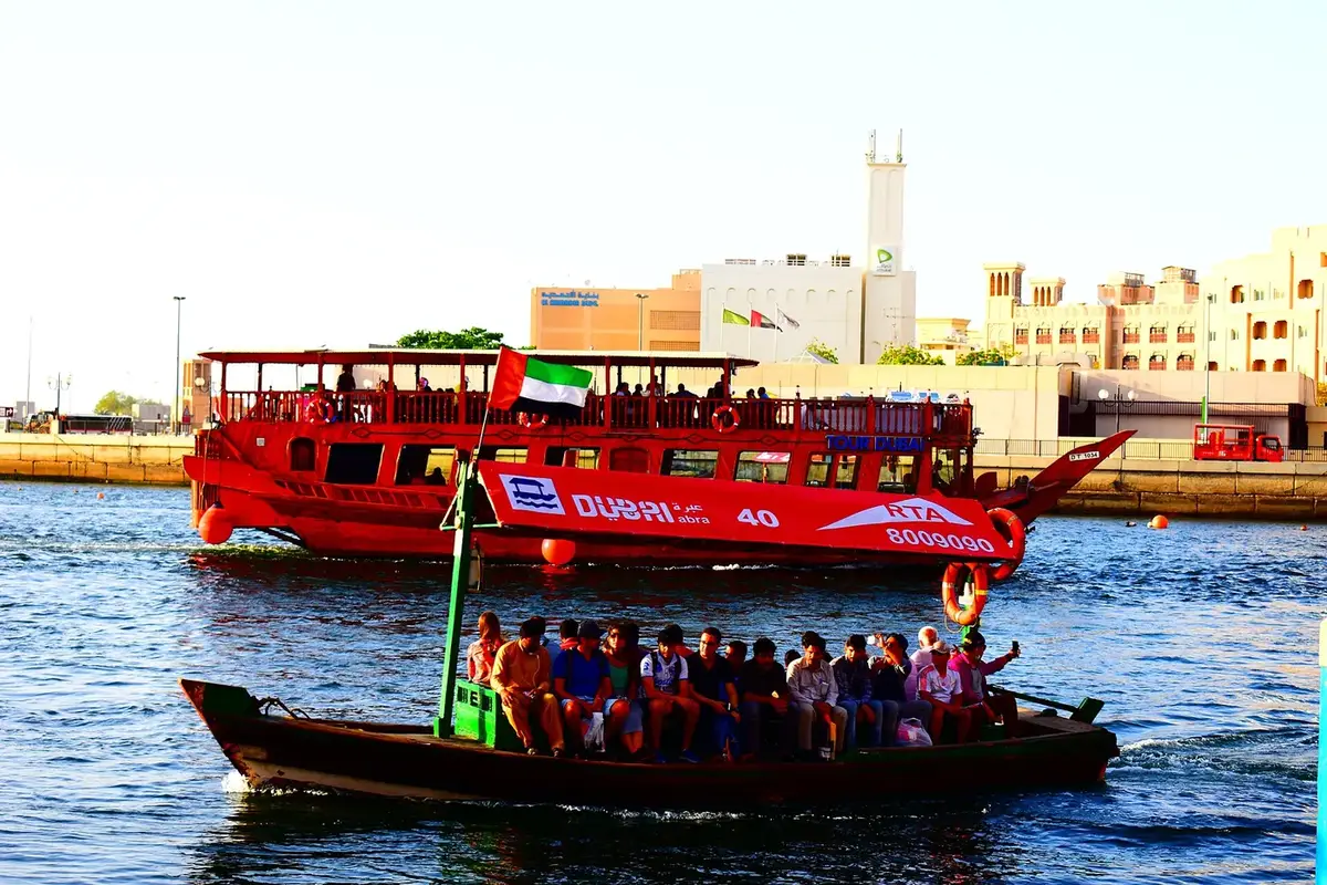 Abras and a ferry crossing Dubai Creek